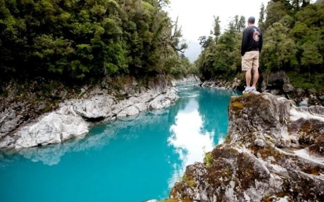 Man looking at Hokitika Gorge, West Coast, New Zealand - Destination New Zealand - Lineupping