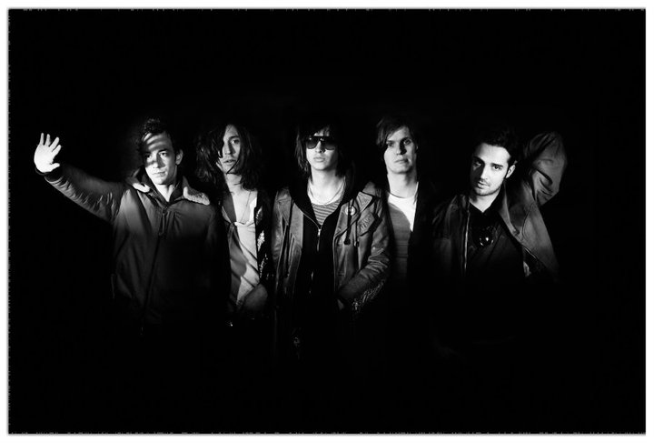 The Strokes stand up with black background - Lineupping.com