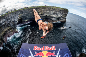David Colturi diving at Downpatrick Head by Romina Amato - Red Bull Cliff Diving 2021 - Lineupping.com