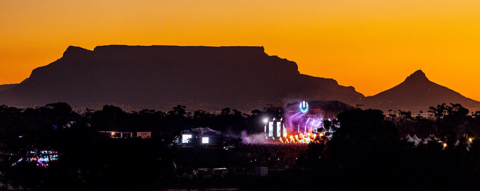 View of Ultra South Africa stage at sunset with mountains on the horizons - credits Ultra South Africa - Ultra South Africa 2023 - Lineupping.com