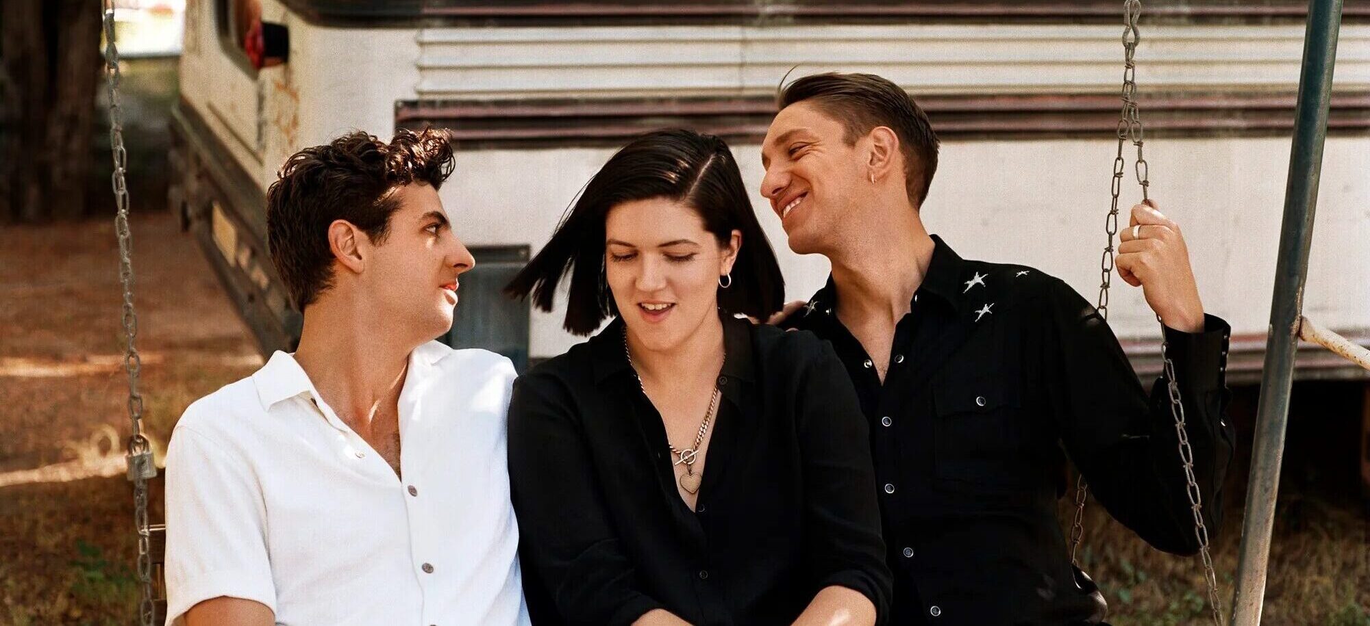 Portrait of The xx band members on a seesaw - credits Alasdair McLellan - The xx tour dates - Lineupping.com